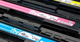 Close-up of CMYK toner cartridges
